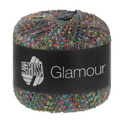 Lana Grossa Glamour 107 Donkerblauw/-grijs bol pailletgaren gefotografeerd tegen een neutrale achtergrond